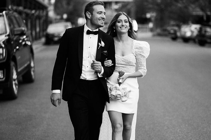 Bride and groom on their way to their Hotel Jerome wedding reception