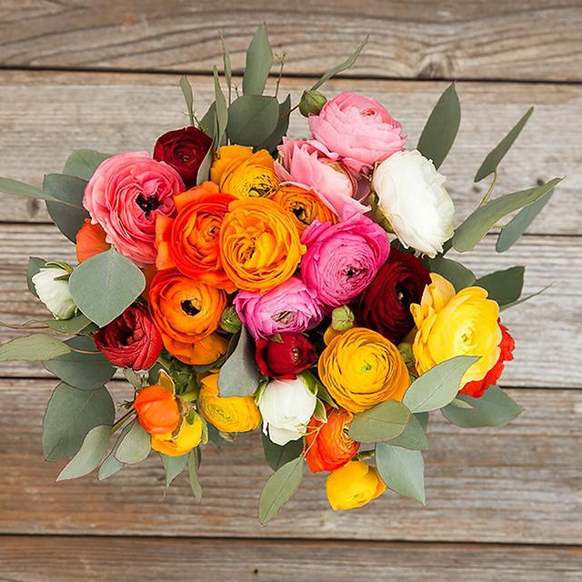 Overhead photo of fresh flower arrangement on wood table