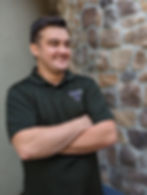 A photo of Eric Gibson wearing his Body Fluent Massage shirt. Photo taken in January 2023.