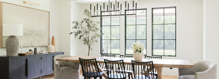 Bradie Fisher Interiors modern farmhouse project black chairs wooden table iron chandelier