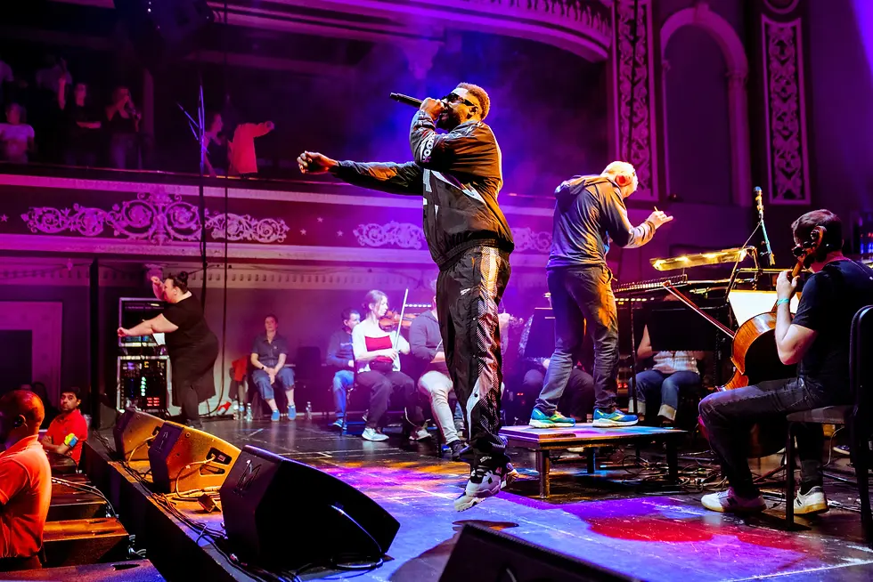 Bassline Symphony live performance with rapper Trilla Jermaine Trillowski and orchestra.