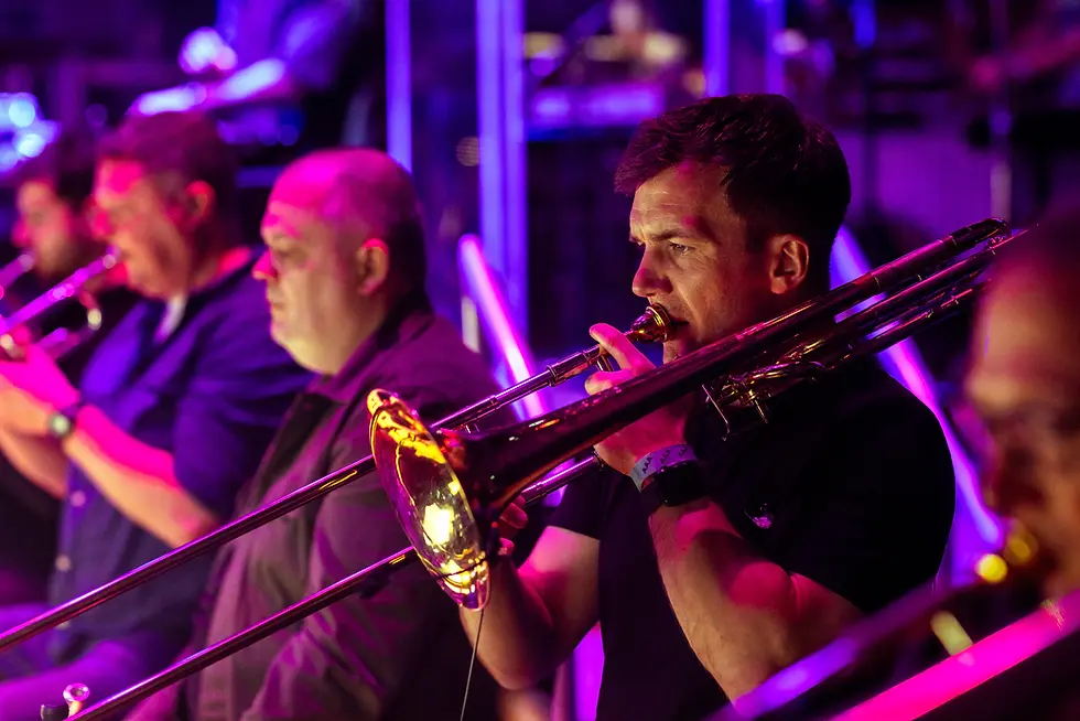 Trombone player performing with Bassline Symphony ensemble.