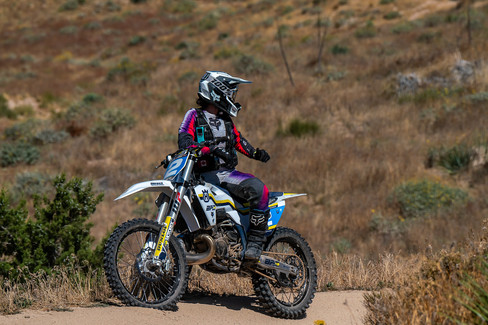 dirt bike rider on the look out to assist