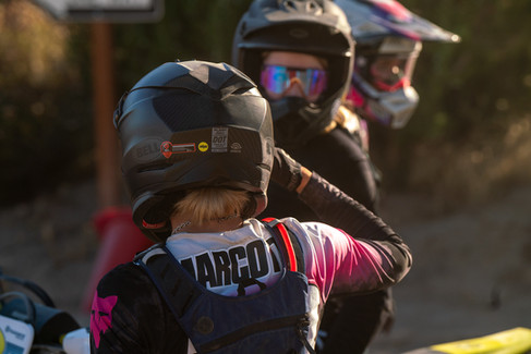 female motocross rider talking to another rider