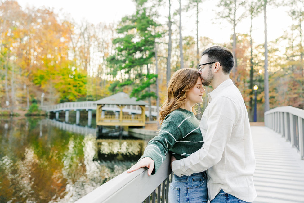 8️⃣ Tender moment couple leaning on bridge University of Richmond engagement