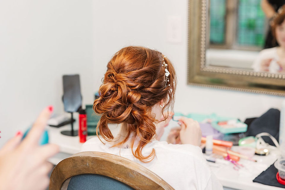 	10.	Finished bridal updo with soft curls and hairpiece from back view