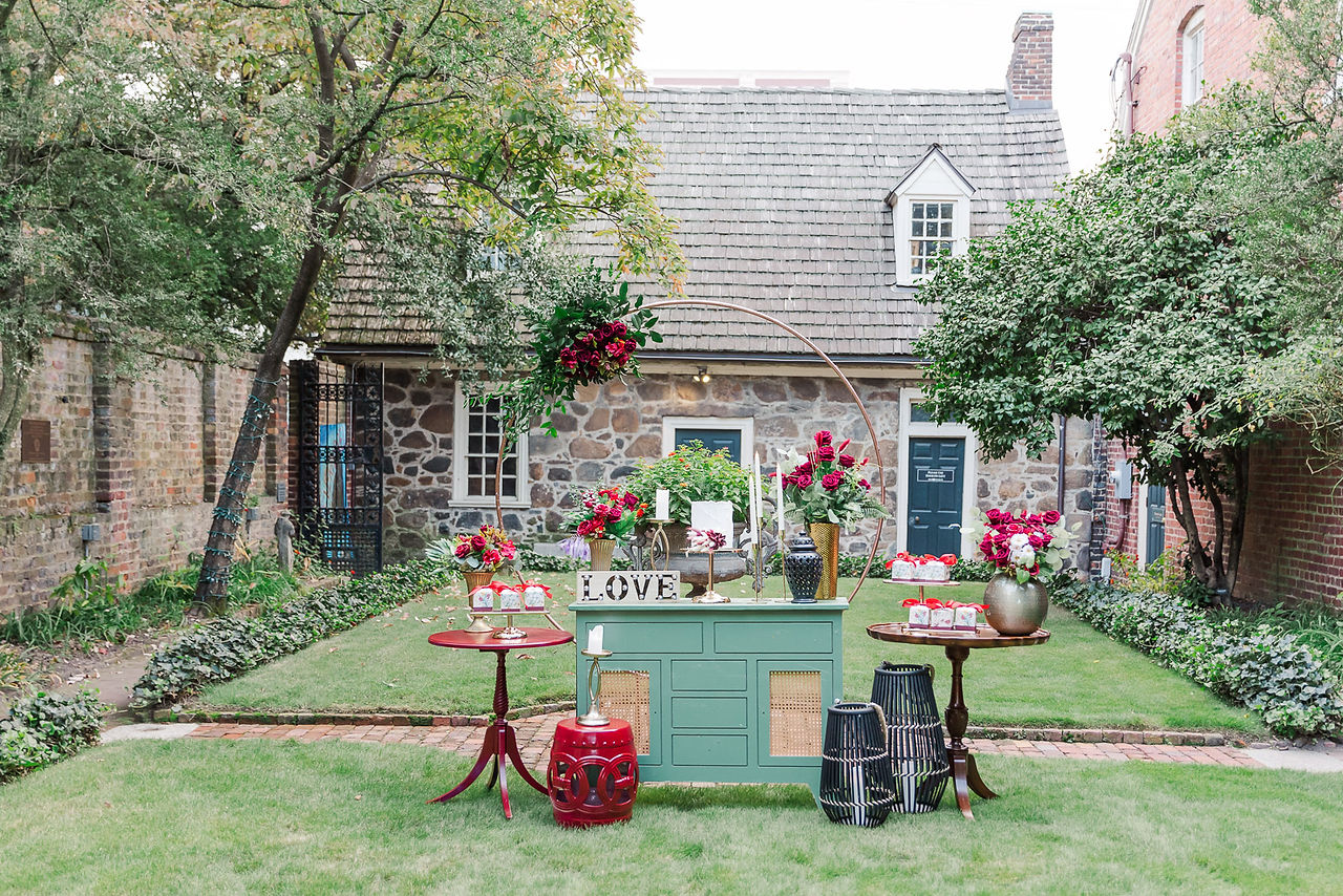 	6.	Wide-angle view of the wedding reception setup in a historic courtyard.
