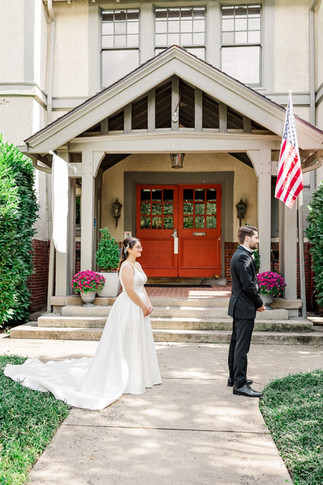 Bride and groom sharing their first look outside a historic wedding venue in Richmond, VA.