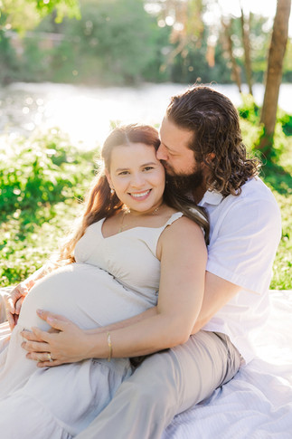 	3.	Couple embracing while expecting their second baby during Richmond maternity photography