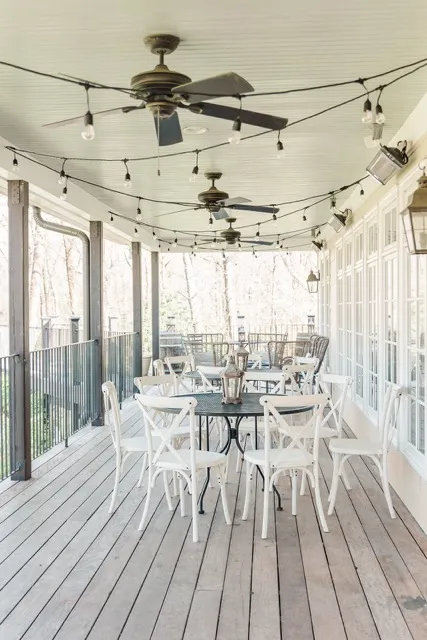 	3.	Bright and airy reception space at The Mill at Fine Creek with white chairs, wooden tables, and floor-to-ceiling windows.