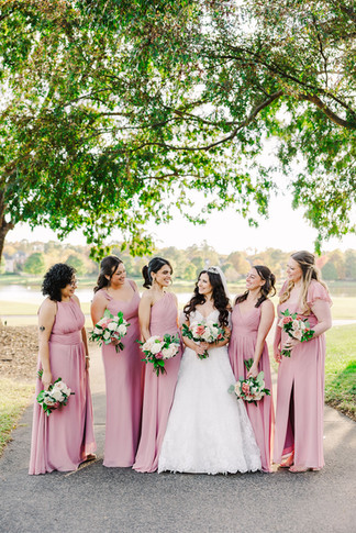 12️⃣ Bridesmaids laughing together in soft pink dresses — relaxed wedding portrait in Richmond, VA.