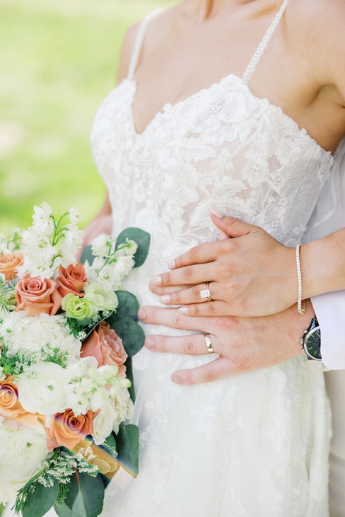 7. Bride holding bouquet and wedding ring during Virginia wedding portraits