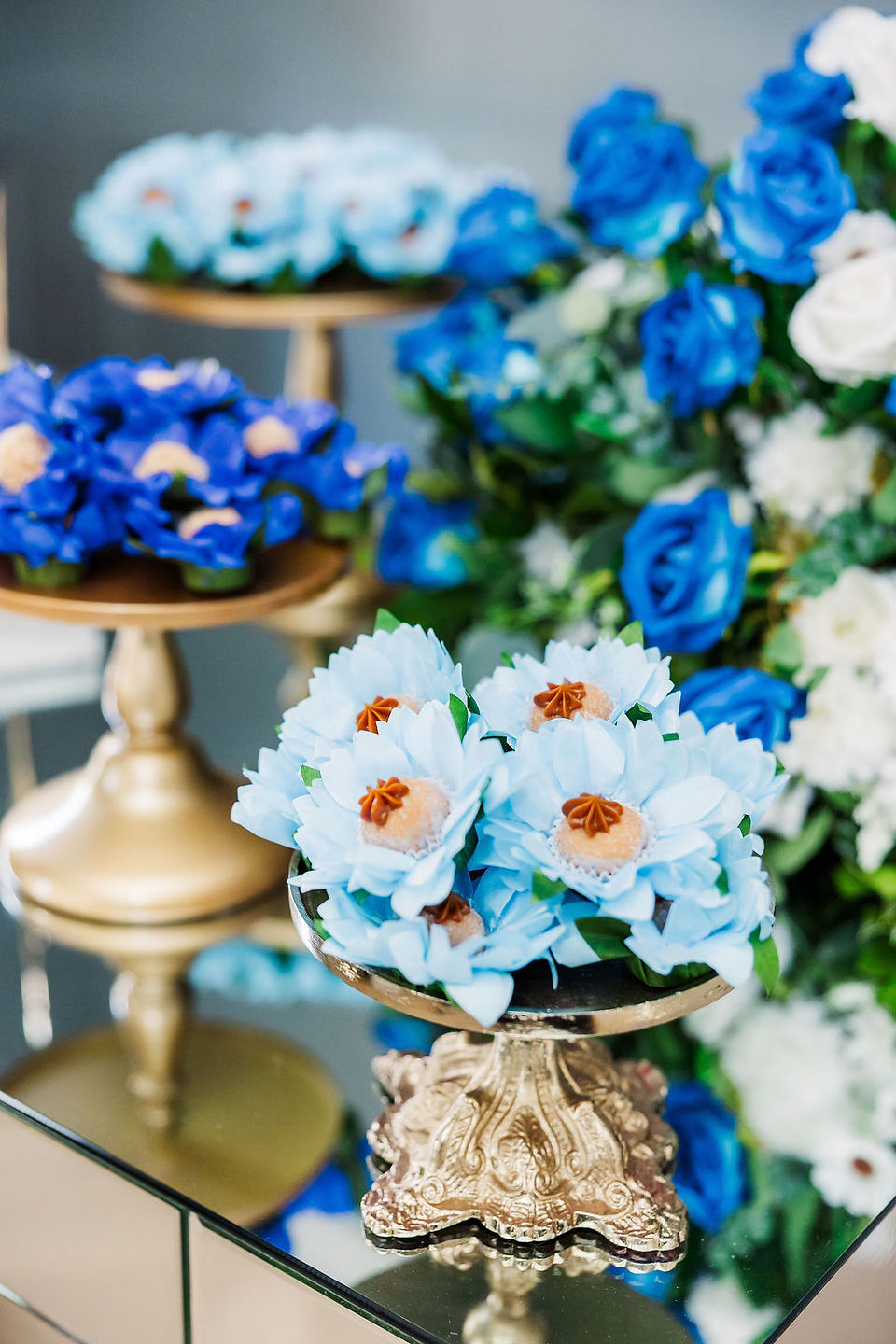 	18.	Elegant blue floral arrangements on gold stands for an intimate wedding in Richmond, Virginia