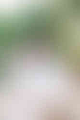 Parents laughing with their daughters during a relaxed family photoshoot at Maymont gardens.