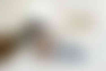 Mother lying beside her newborn baby during a calm lifestyle newborn session in Richmond Virginia