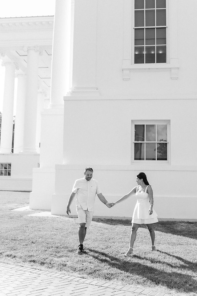 	9.	Black and white photo of the couple walking hand in hand near the Virginia State Capitol.