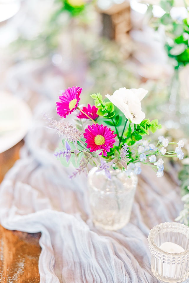 	7.	Mini vase with wildflowers on lace table runner