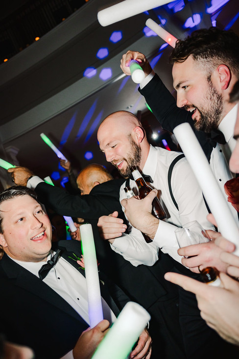 5️⃣ Groom and friends celebrating on the dance floor — candid Richmond wedding reception moment.