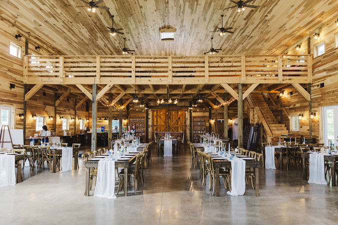 	7.	Wide shot of reception space inside The Barns with hanging drapes and lights