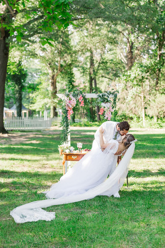 17. “Groom dipping bride in kiss after wedding ceremony at The Virginia Cliffe Inn”