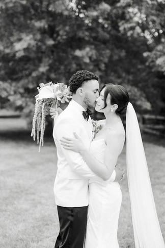 3. Black and white portrait of bride and groom kissing during their romantic Virginia wedding day