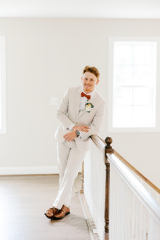 14. Groom portrait on staircase at Antebellum of New Kent wedding venue