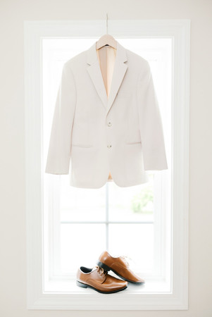 9. White groom jacket hanging before wedding at Antebellum of New Kent