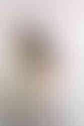 2. Richmond photographer photographing parents holding newborn baby in neutral nursery.