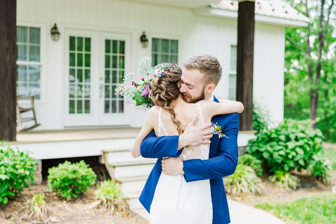 7. Couple hugging during emotional first look moment