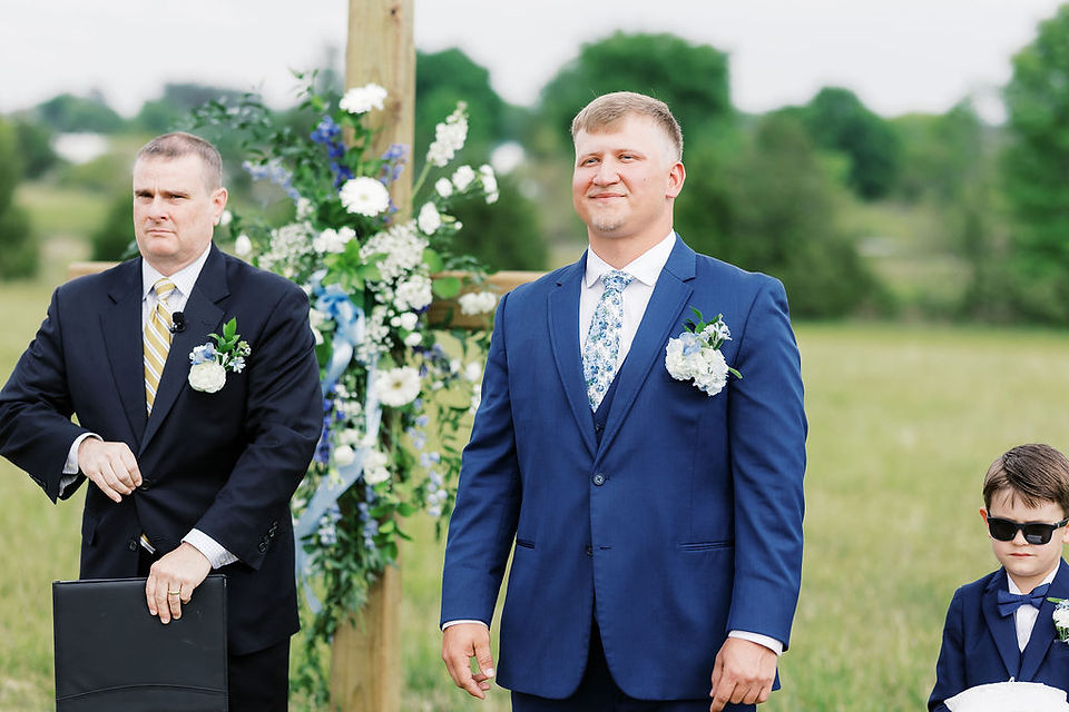 5. Groom watching bride walk down the aisle at Foxrun Venue wedding