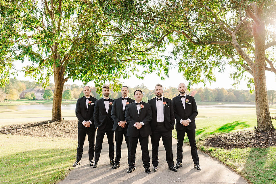 18️⃣ Groomsmen walking in a line through shaded path — classic Richmond wedding photographer portrait.