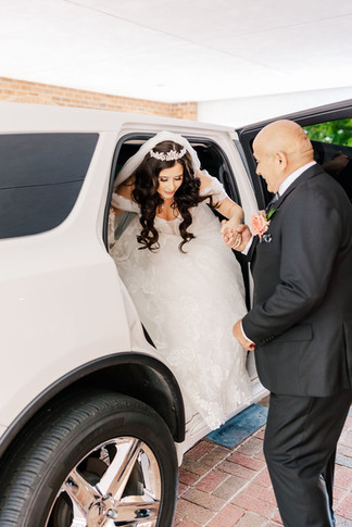 6. Bride smiling as she exits the car — joyful pre-ceremony photo at Richmond wedding venue.