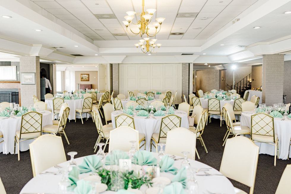 	2.	Reception room with round tables and gold chairs set up