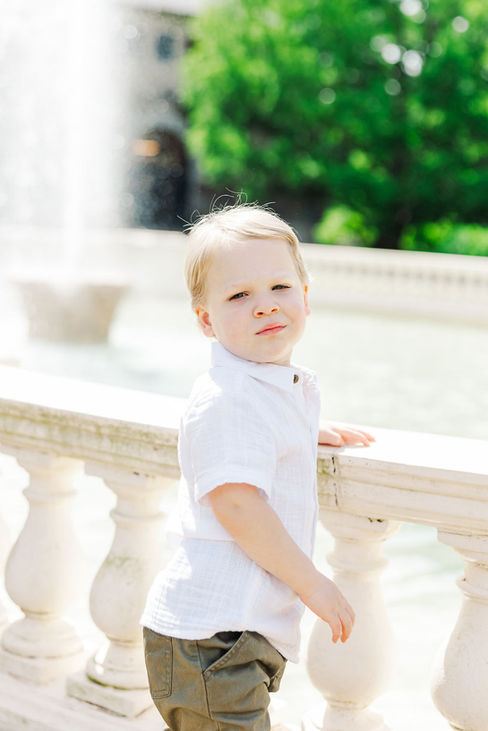 3. Toddler playing near water fountain in Richmond park