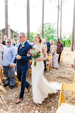 5. Bride walking down aisle with father at Timber Creek