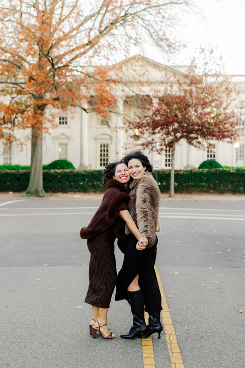 	9.	Candid moment of two women laughing together during an extended family session