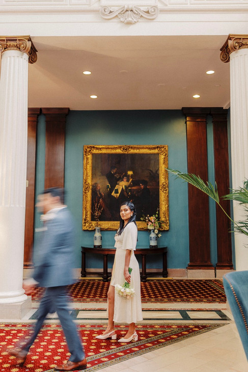 	10.	“Bride gazing thoughtfully while holding bouquet inside The Jefferson Hotel”
