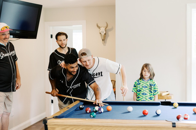 8. Groom and groomsmen playing pool before Virginia wedding ceremony