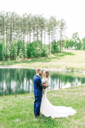 13. Bride and groom by lake during spring wedding