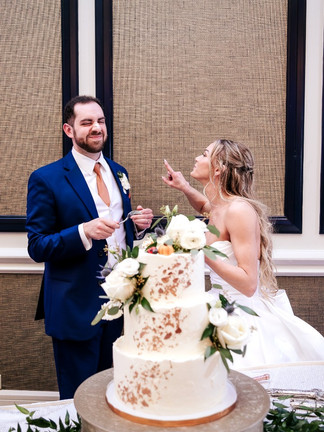bride and groom cutting the cake at the omni hotel as a richmond wedding venues