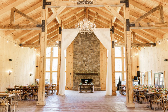 2. Reception hall with stone fireplace at Timber Creek Farm