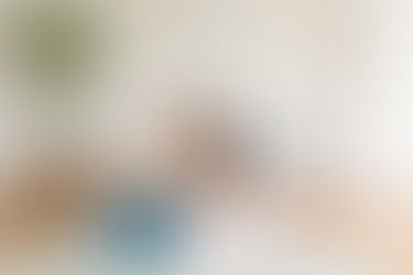 	14.	Parents sitting on nursery floor with baby in front of white crib