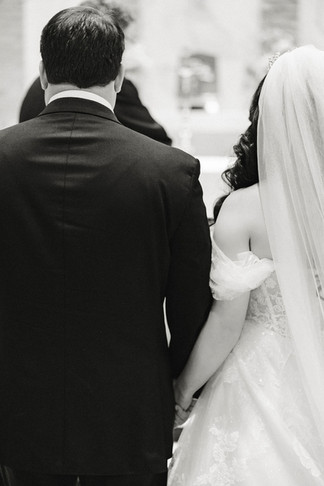 14. Close-up of bride and groom holding hands during ceremony — intimate Richmond wedding photographer moment.