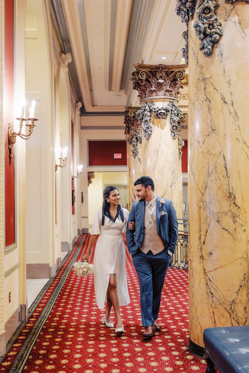 	5.	“Couple sharing an intimate kiss in the luxurious hallway of The Jefferson Hotel”
