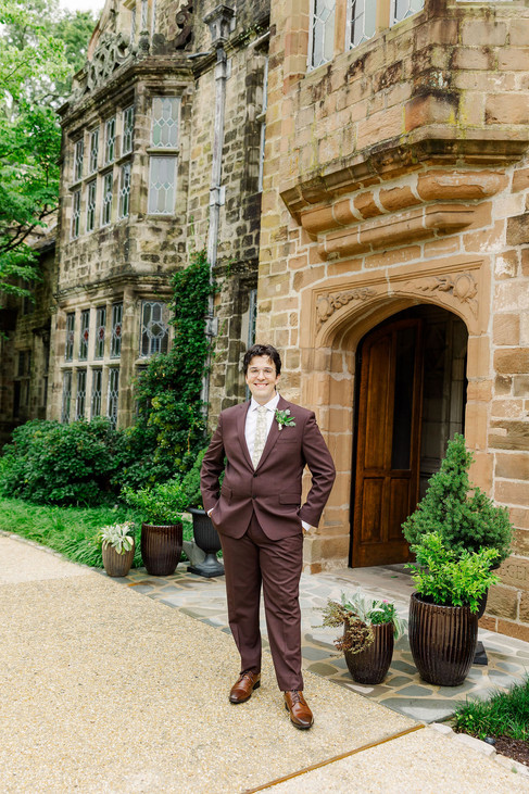 	13.	Groom standing solo at the arched entrance of Virginia House