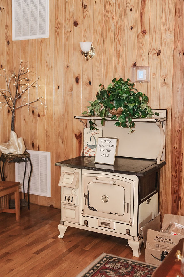 	17.	“Rustic indoor wedding décor with greenery and welcome table at The Virginia Cliffe Inn”