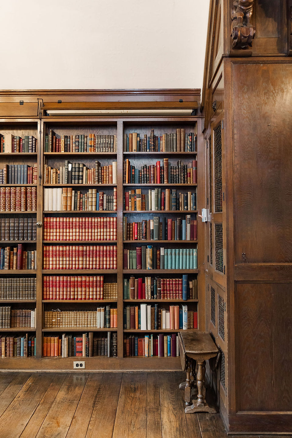 	15.	Bookshelves filled with vintage books inside the Virginia House library