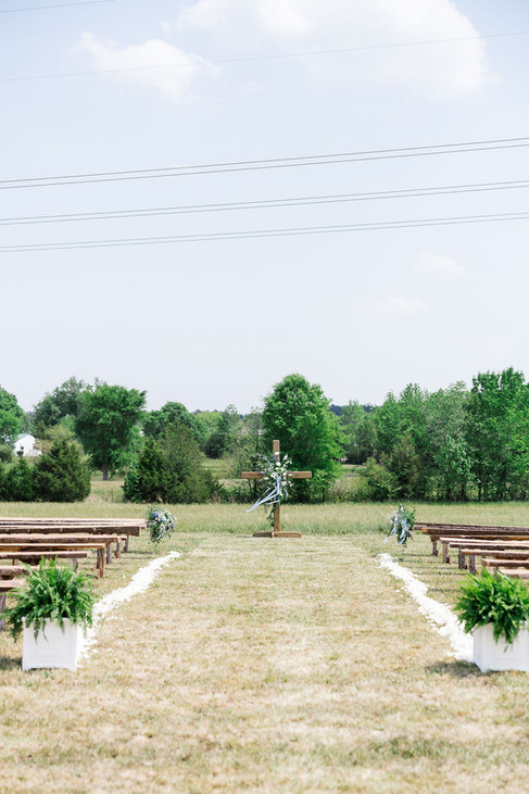 2. Wedding ceremony aisle in open field at Foxrun Venue & Events in Lunenburg Virginia