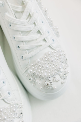 1. White bridal sneakers with rhinestone details — fun and comfortable wedding day shoes photographed by Richmond wedding photographer.