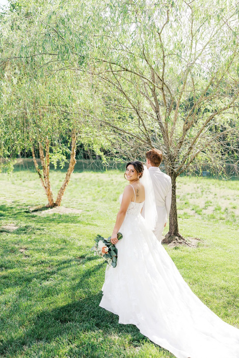 6. Bride walking under trees during Antebellum of New Kent wedding portraits
